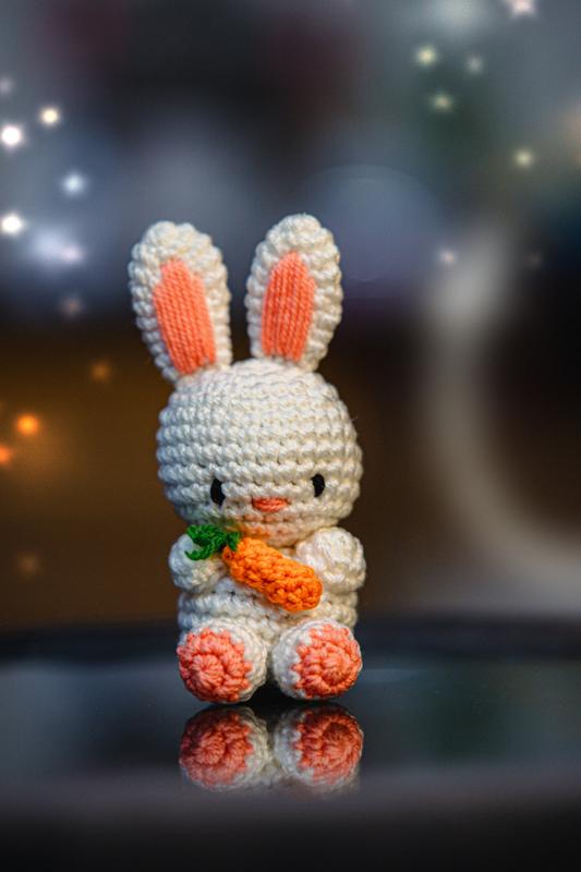 White crochet bunny holding a carrot